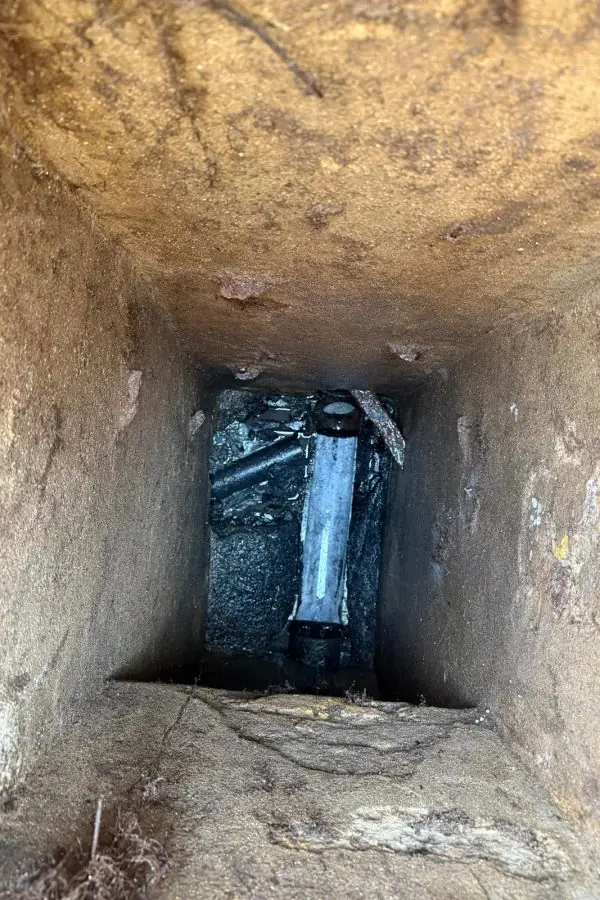 New pipe visible at the bottom of an inspection chamber