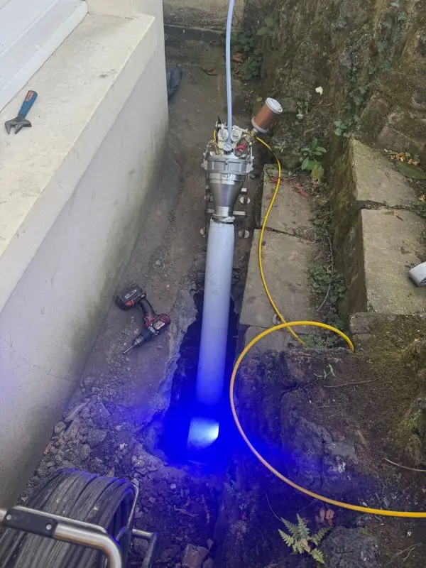 BlueLight LED curing a liner inside an exposed drain